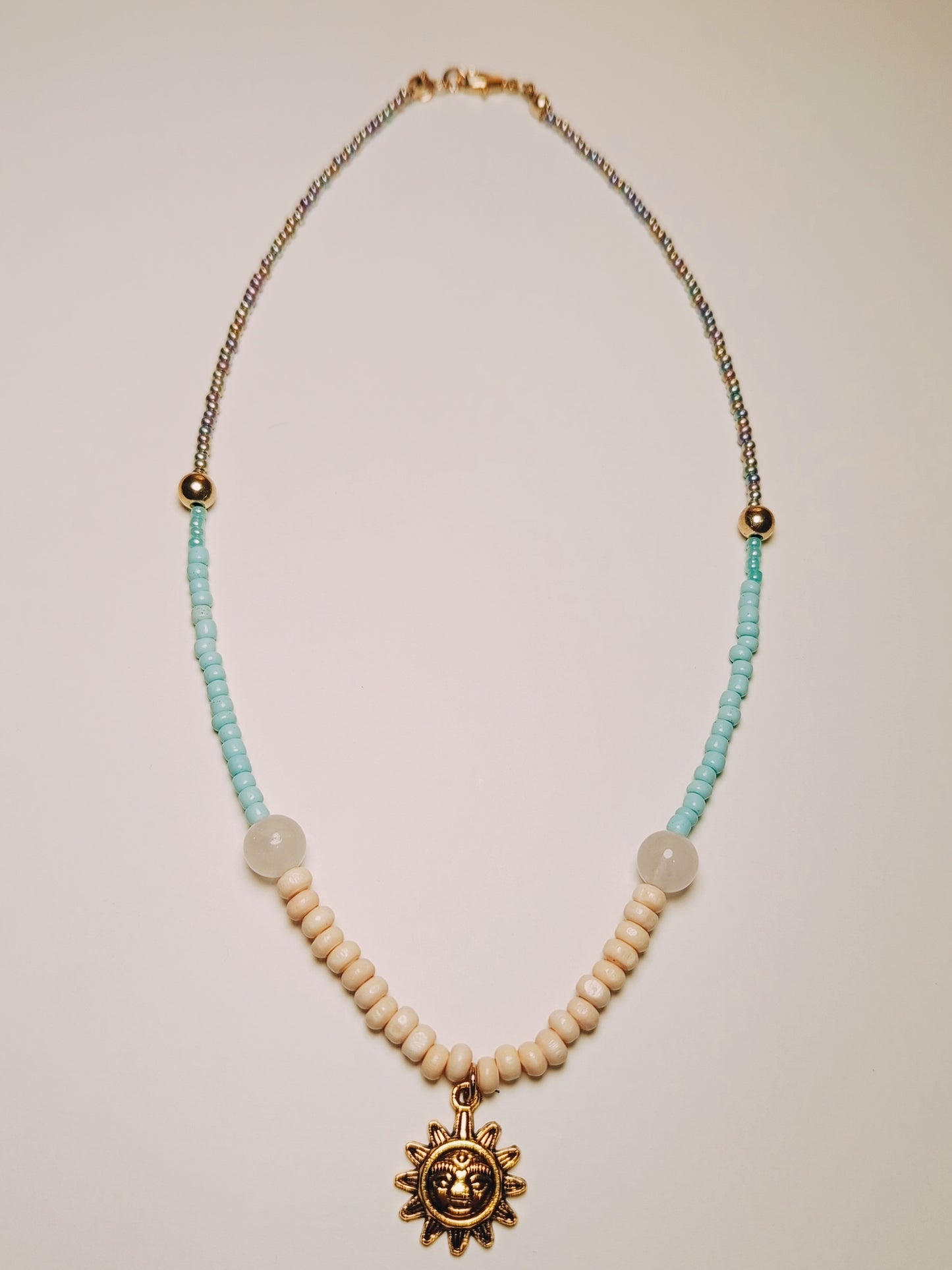 Turquoise Sand Necklace with Sun & Elephant Pendant