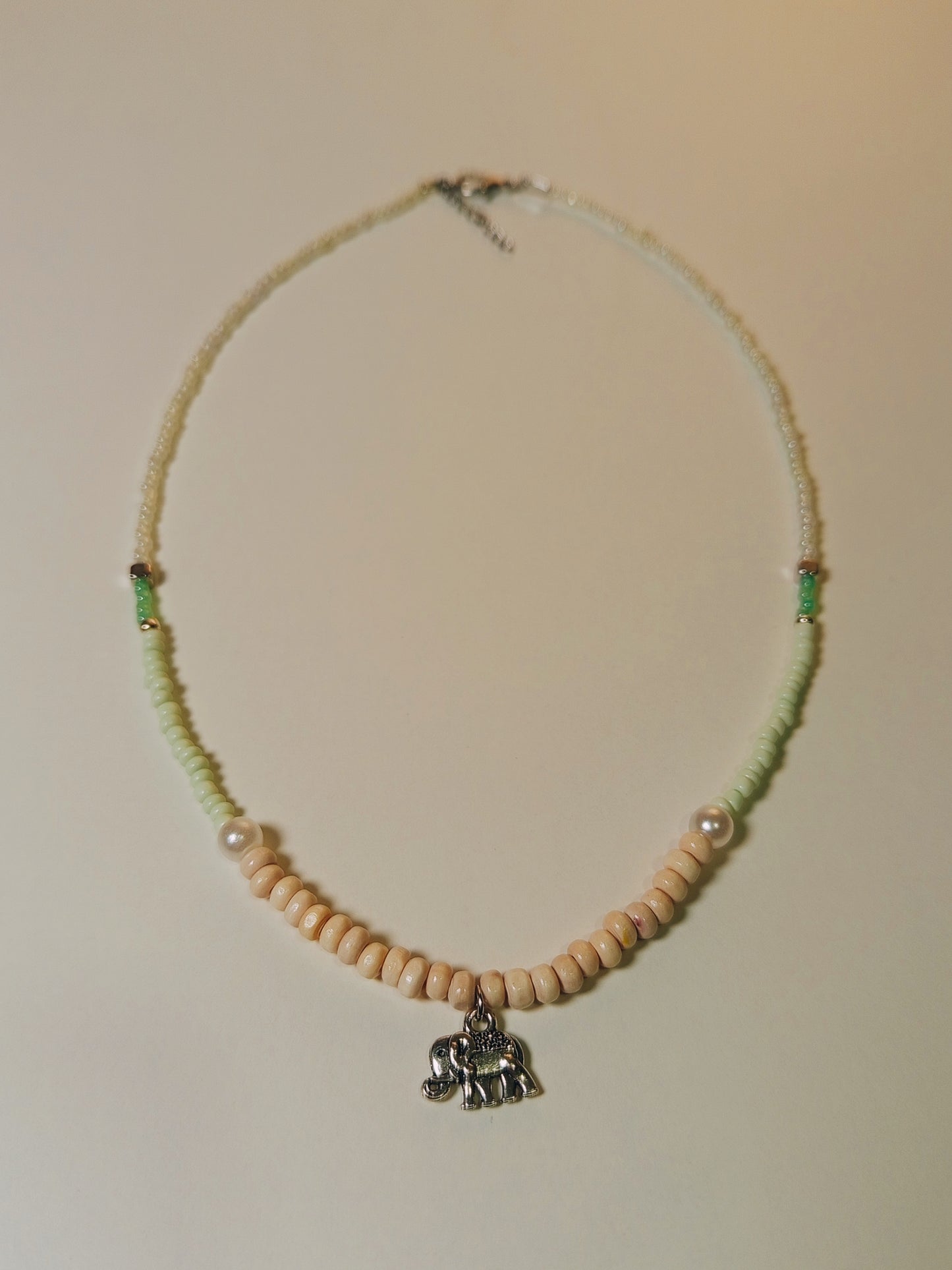 Turquoise Sand Necklace with Sun & Elephant Pendant